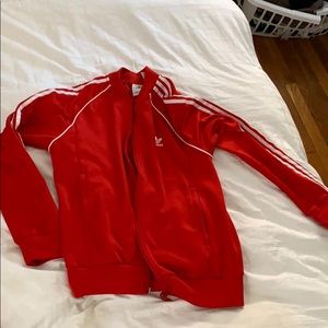 Red adidas track suit